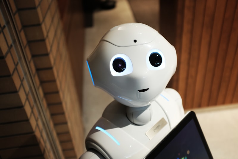 A humanoid robot figure looking thoughtfully toward a bright light source