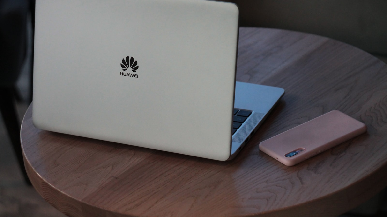 A person typing on a laptop with a glowing privacy padlock icon overlaid